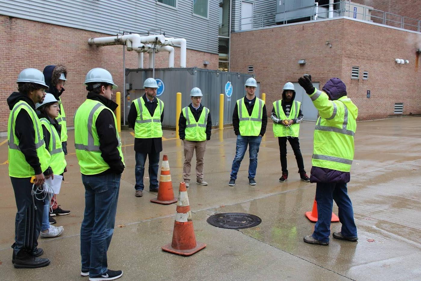 OSH students receiving instruction outside while wearing safety equipment